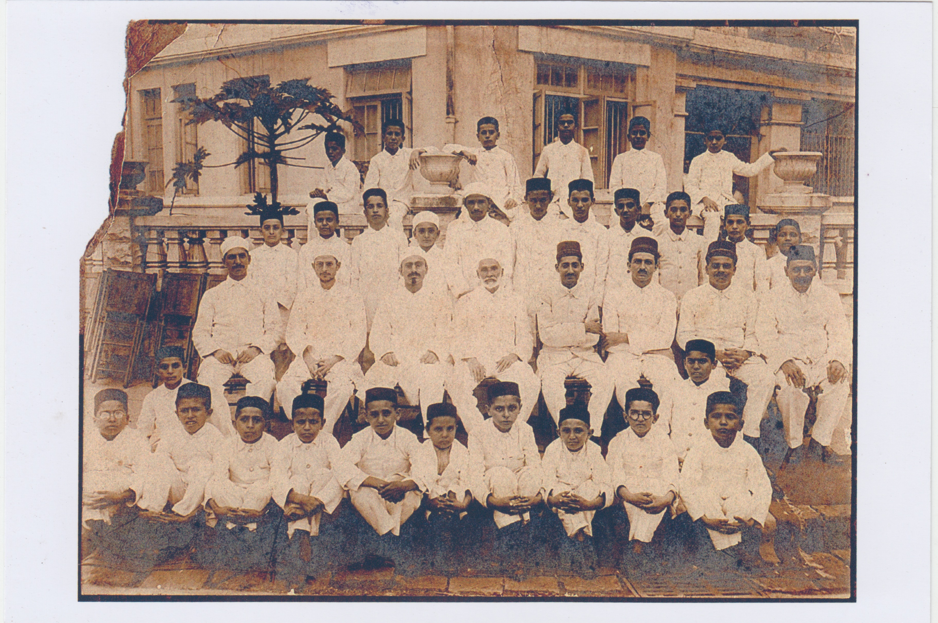 Vintage sepia group portrait of students and teachers on the Madressa balcony